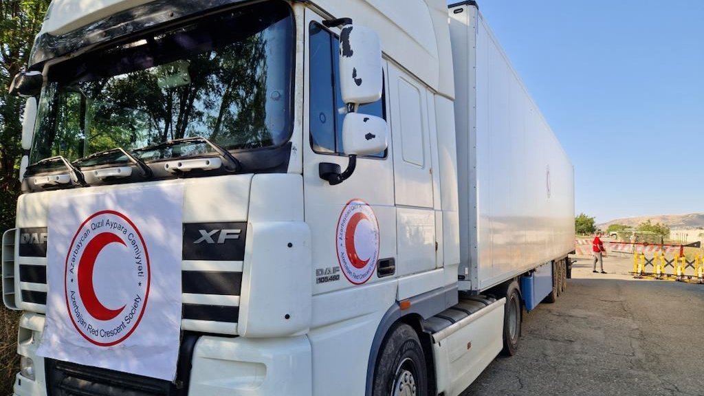 Trucks with flour from Baku for Armenian residents of Karabakh stand still on Aghdam-Khankendi road